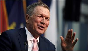 Ohio Gov. John Kasich, a former 2016 Republican Presidential hopeful, smiles as he addresses a gathering during a visit to New England College in Henniker, N.H., Tuesday, April 3, 2018. Kasich restored Ohio's membership in the National Governors Association as he seeks to shore up credibility for bipartisan deal-making that could bolster a 2020 bid for president.