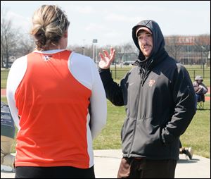 Derrick Vicars, Bowling Green State University throwing coach, gives instructions during the shot put.