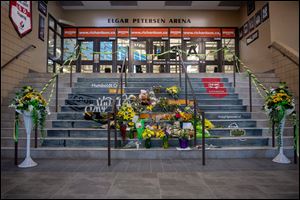 A memorial at the stairs that lead to Elgar Petersen Arena is shown in Humboldt, Saskatchewan, on Saturday, April 7, 2018. 