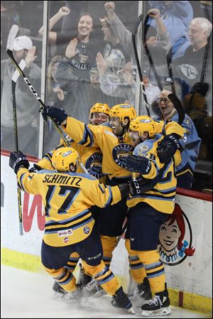 Toledo Walleye forward Tyler Barnes celebrates scoring the game winning goal in double overtime against the Indy Fuel in Game 1 of their ECHL playoff series Friday at the Huntington Center in downtown Toledo.
