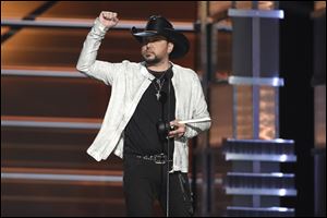 Jason Aldean accepts the award for entertainer of the year at the 53rd annual Academy of Country Music Awards.