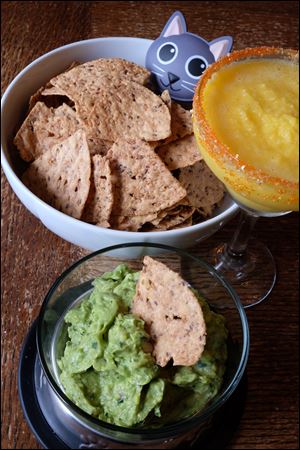 2nd annual National Cat Lady Day. Guacamole with Oreja de Gato Chips and Mango Meow-garita. 