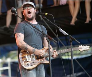 Isaac Brock, of Modest Mouse performs with his band at Lollapalooza at Grant Park in Chicago on Sunday, Aug. 5, 2007. The three-day festival, headlined by Pearl Jam, includes 130 bands. 