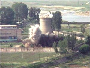 In this 2008 TV image,  the demolition of the 60-foot-tall cooling tower at a reactor complex in Yongbyonm, North Korea is seen.  North Korea's Foreign Ministry said Saturday it will hold a 