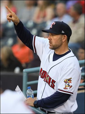 Like many triple-A manager, Toledo Mud Hens manager Doug Mientkiewicz, shown during a game against the Columbus Clippers this season, has had to deal with a revolving door of a roster.