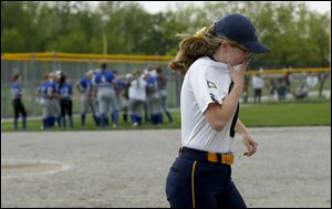 Notre Dame's Madeline Miller cries as she walks of the field after their loss to Anthony Wayne in the Div. 1 District 1 semi-final softball game at Rolf Park in Maumee.