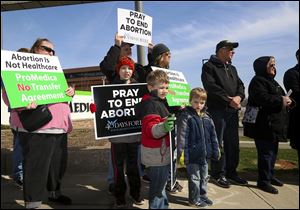 Protesters at a recent rally call on ProMedica to undo its agreement with Capital Care abortion clinic.