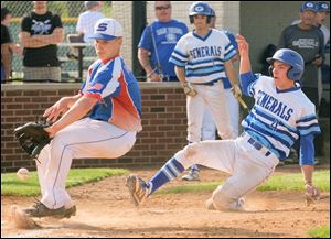 Anthony Wayne's Andrew Murphy scores as Springfield pitcher Triston Todorowski waits for the ball during a Division I baseball district semifinal game in Bowling Green. 