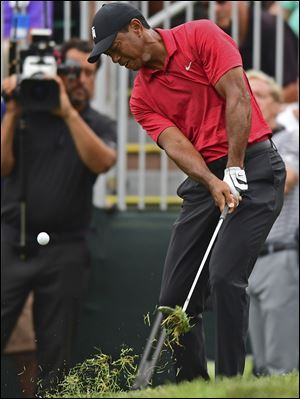 Tiger Woods follows his shot from the rough on the seventh hole during the final round of The Memorial. 