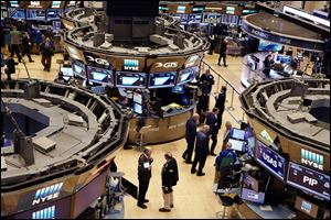 Traders work the floor at the New York Stock Exchange. 
