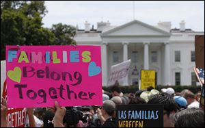 Activists march past the White House to protest the Trump administration's approach to illegal border crossings and separation of children from immigrant parents in June.