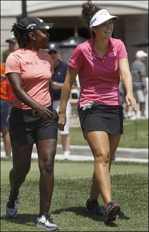 Mariah Stackhouse, left, and Emma Talley share a laugh as they head down the number one fairway after teeing off during the first round of the LPGA Marathon Classic.