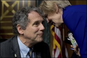 Sens. Sherrod Brown (D., Ohio), left, and Elizabeth Warren (D., Mass.) are part of a bipartisan effort to reduce U.S. use of Russian energy.