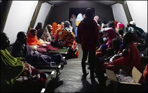 People affected by the earthquake rest at a temporary shelter in Lombok, Indonesia, Sunday, Aug. 5, 2018. 