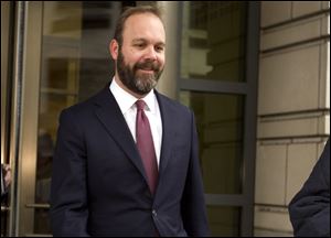 In this Feb. 23, 2018, file photo, Rick Gates leaves federal court in Washington. 