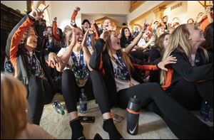 The BGSU women's soccer team cheers while watching the NCAA tournament selection show in Monday in Bowling Green.